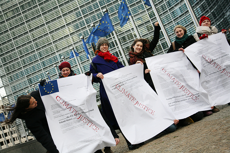 European youth demand climate justice for the Alliance of Small Island States (AOSIS) during an action outside the <br />European Commission at the time of the Durban COP17 climate talks. Photo for Young Friends of the Earth Europe. <br />BELGIUM, Brussels | 2011